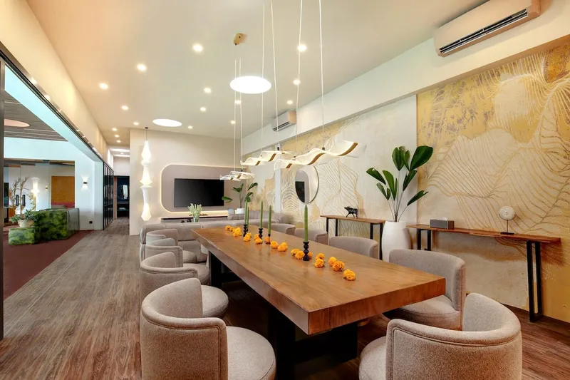 A functional open-access living, dining, and lounge area with seamless pool access.
