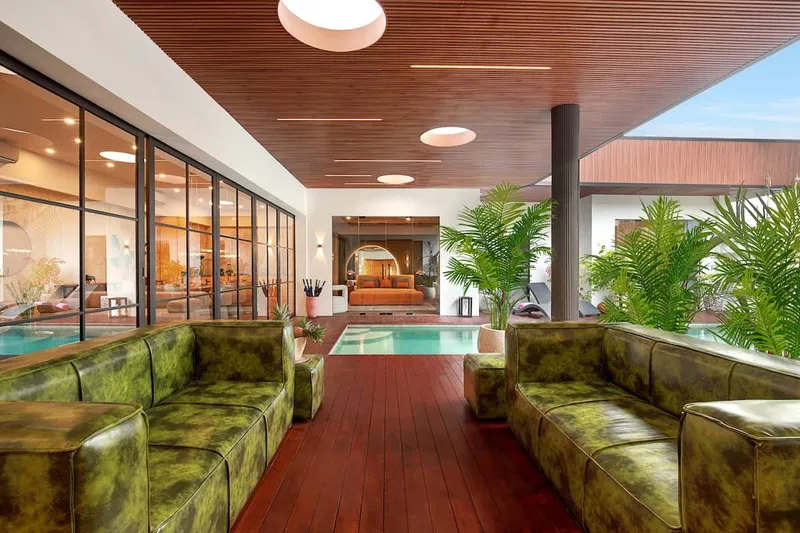 Spacious lounge area with direct pool access